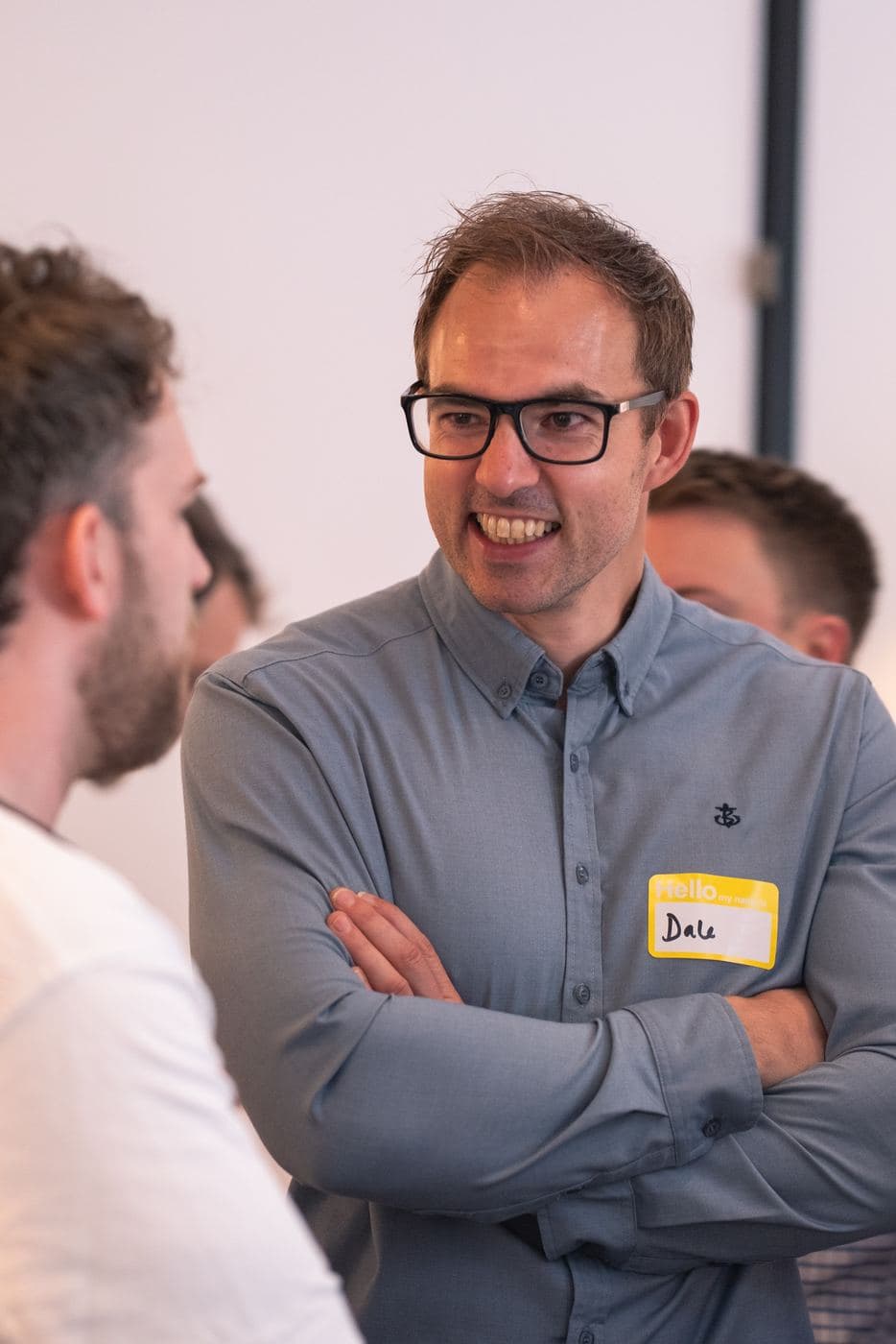 An attendee laughing during the networking